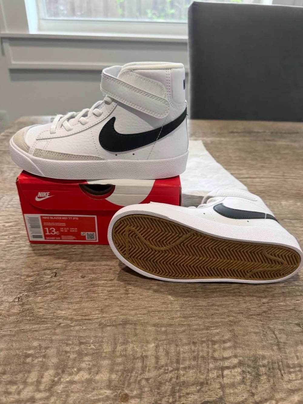 Nike Kids High-Top Sneakers in White with Black Swoosh
